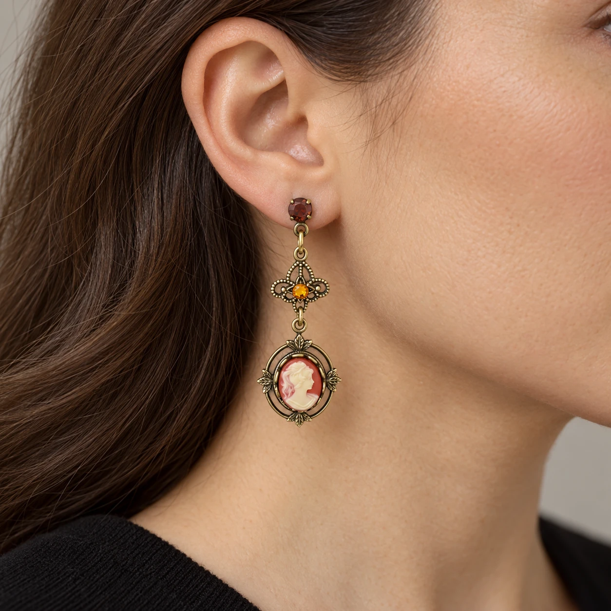 AI styling preview of Carnelian-Tone Cameo Filigree Drop Earrings worn on a model