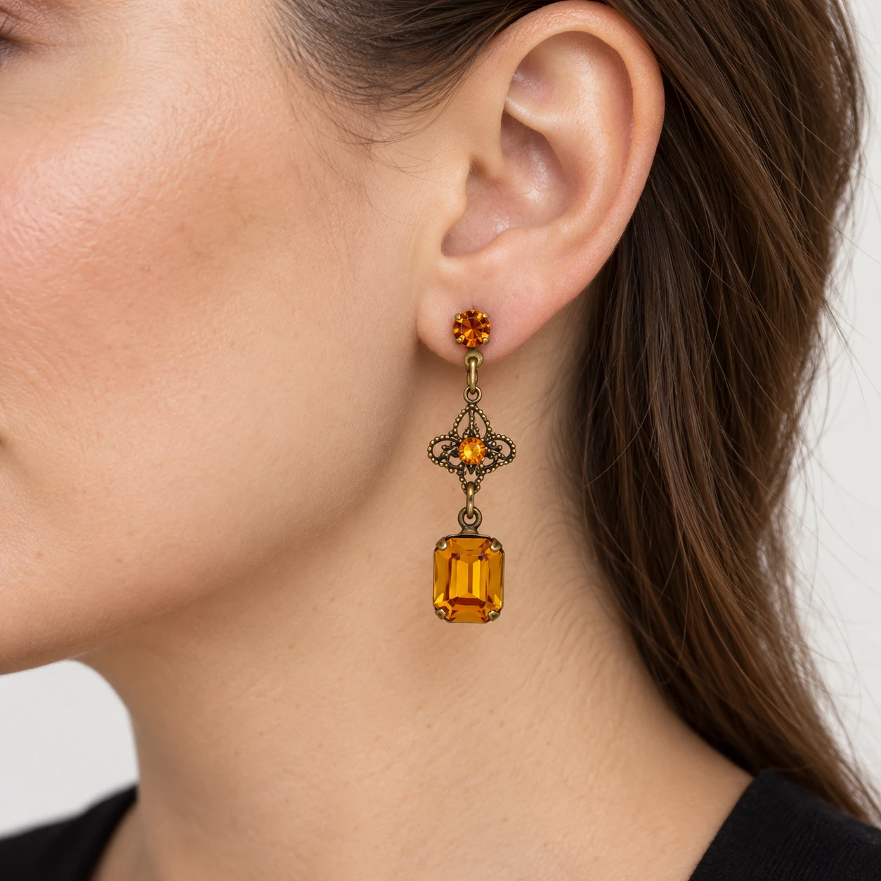 AI styling preview of Topaz-Tone Octagon Filigree Earrings worn on a model